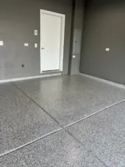 an empty room with windows and entrance