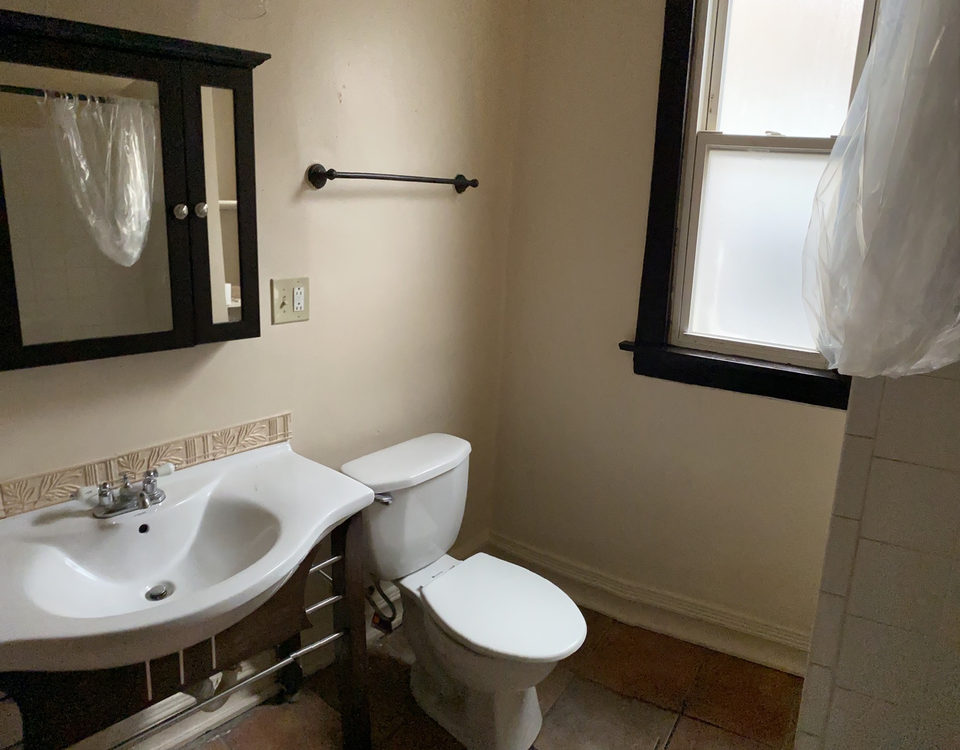 6546 South Rockwell Street, Unit 2 Chicago, IL 60629 - Photo 19 of 25 a bathroom with a toilet sink and mirror