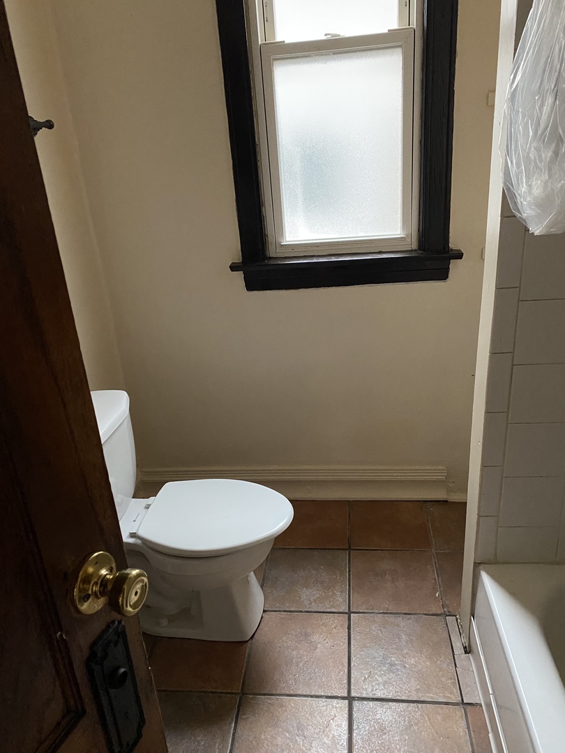 6546 South Rockwell Street, Unit 2 Chicago, IL 60629 - Photo 22 of 25 a bathroom with a toilet
