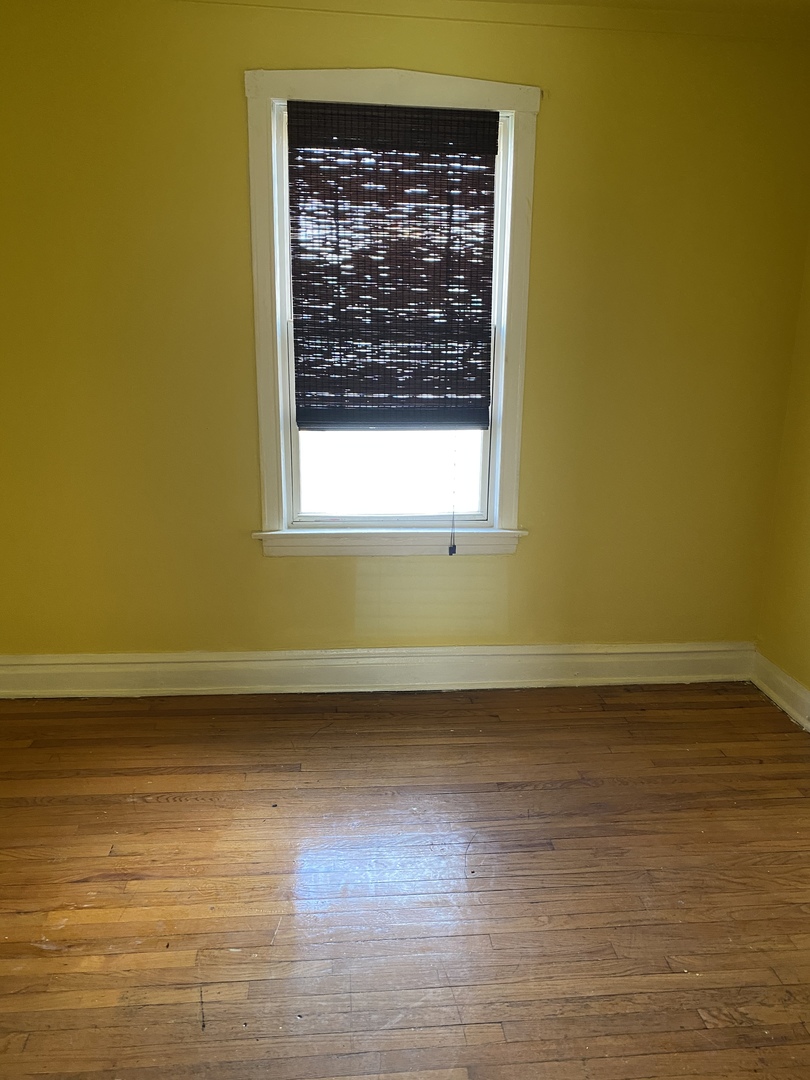 6546 South Rockwell Street, Unit 2 Chicago, IL 60629 - Photo 9 of 25 a view of a room with wooden floor and a window