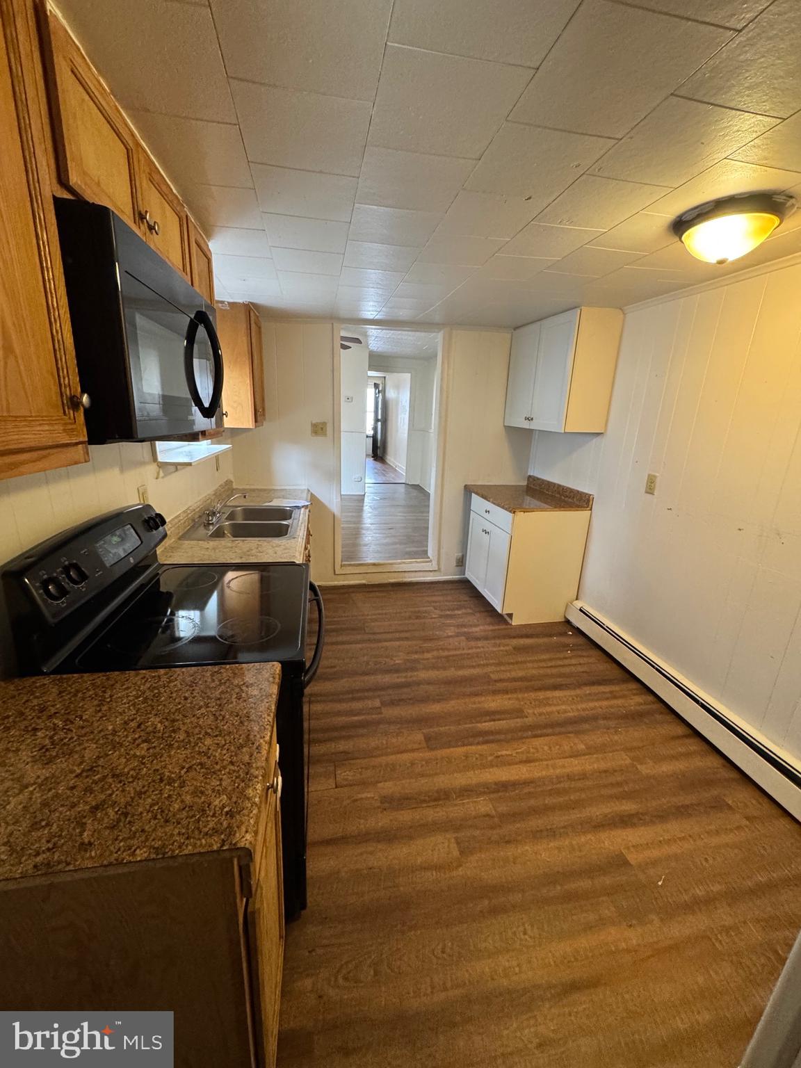 362 South 3rd Street Columbia, PA 17512 - Photo 5 of 14 a bedroom with a bed and wooden floor