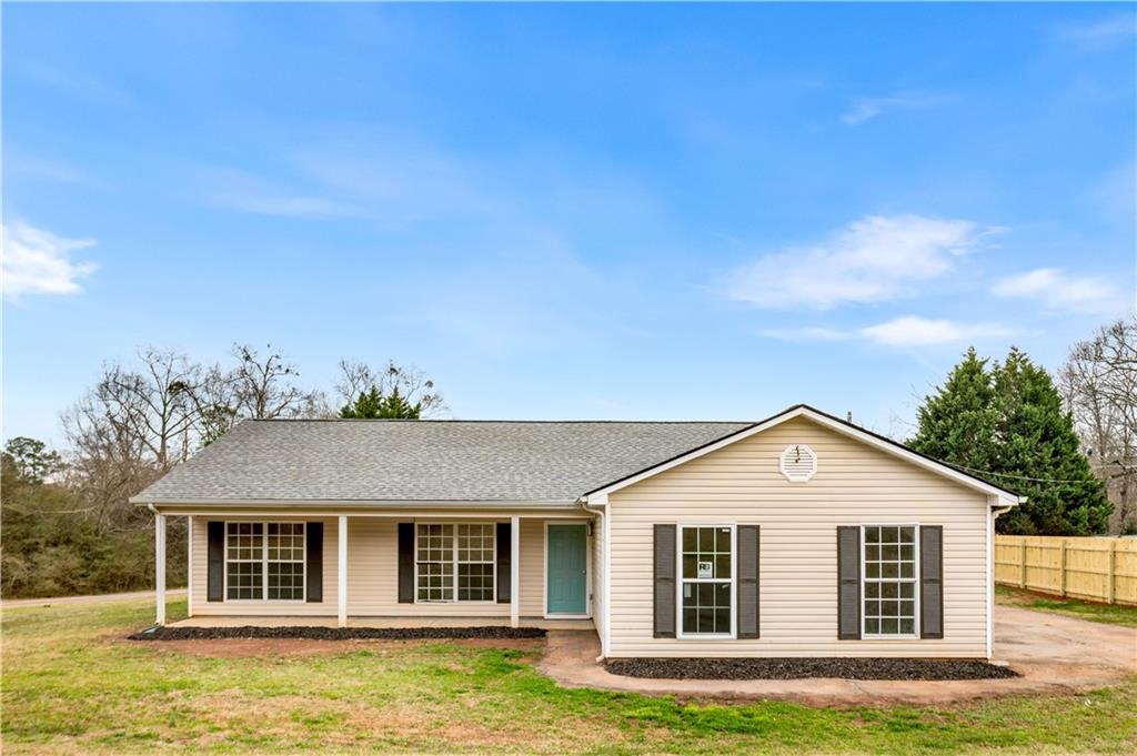 front view of a house with a yard