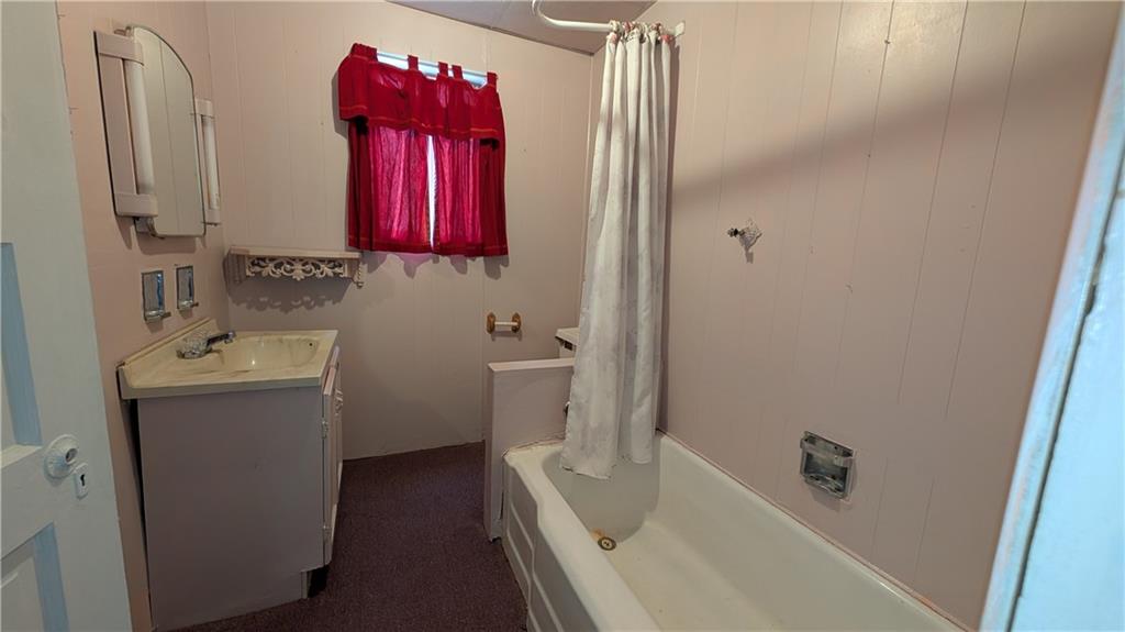 38 Ridge Road Brownsville, PA 15417 - Photo 13 of 18 a bathroom with a tub sink and mirror