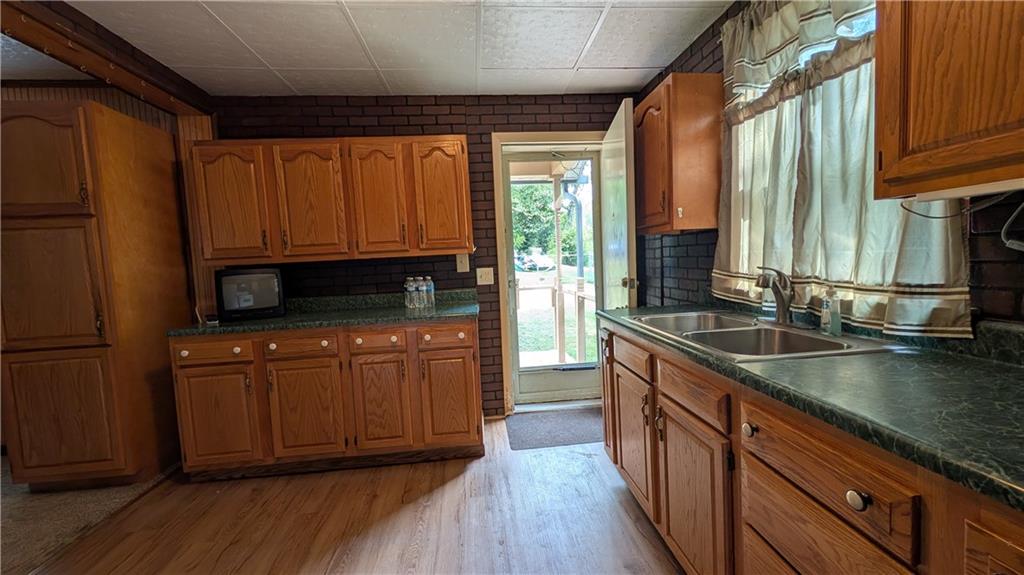 38 Ridge Road Brownsville, PA 15417 - Photo 4 of 18 a kitchen with stainless steel appliances granite countertop a stove a sink and a refrigerator