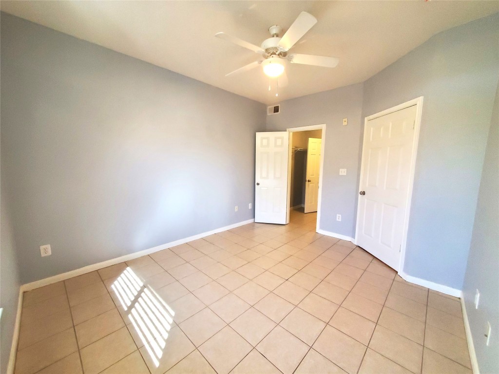 2209 Hancock Drive, Unit 16 Austin, TX 78756 - Photo 11 of 20 a view of an empty room and chandelier fan