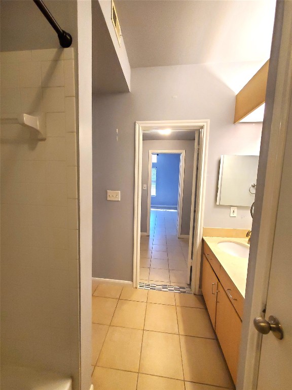 2209 Hancock Drive, Unit 16 Austin, TX 78756 - Photo 13 of 20 a bathroom with a tub shower and sink