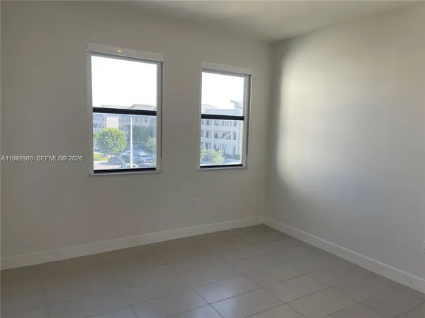 an empty room with windows