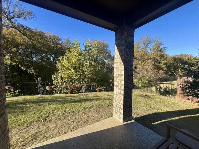a view of a yard with an outdoor seating