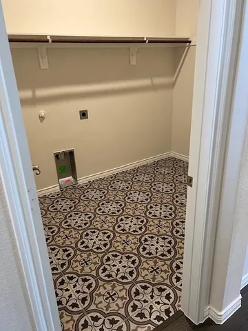 a bathroom with a window and a shower