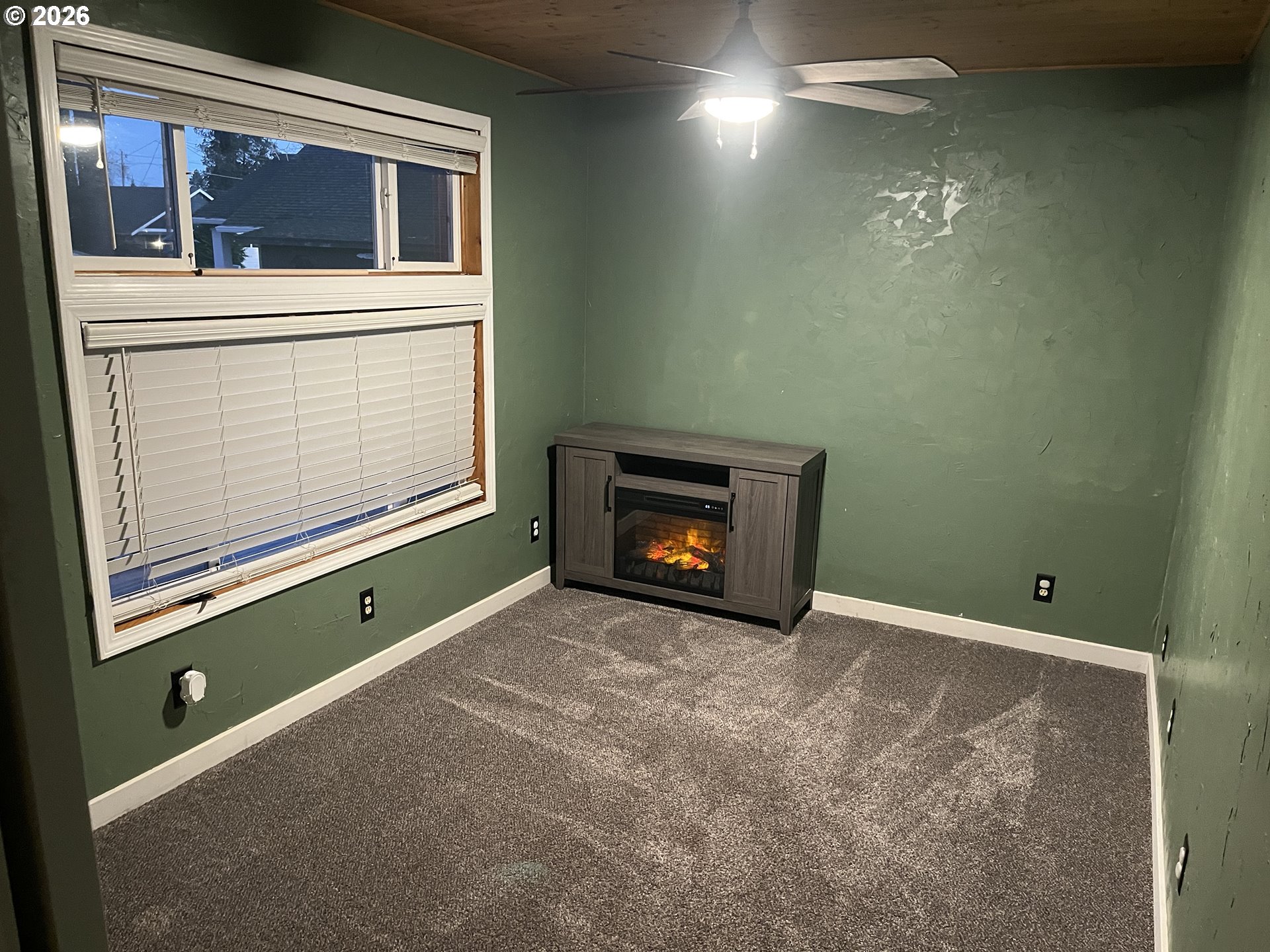 1918 Southeast 6th Avenue Camas, WA 98607 - Photo 2 of 17 a view of an empty room with a fireplace and a window