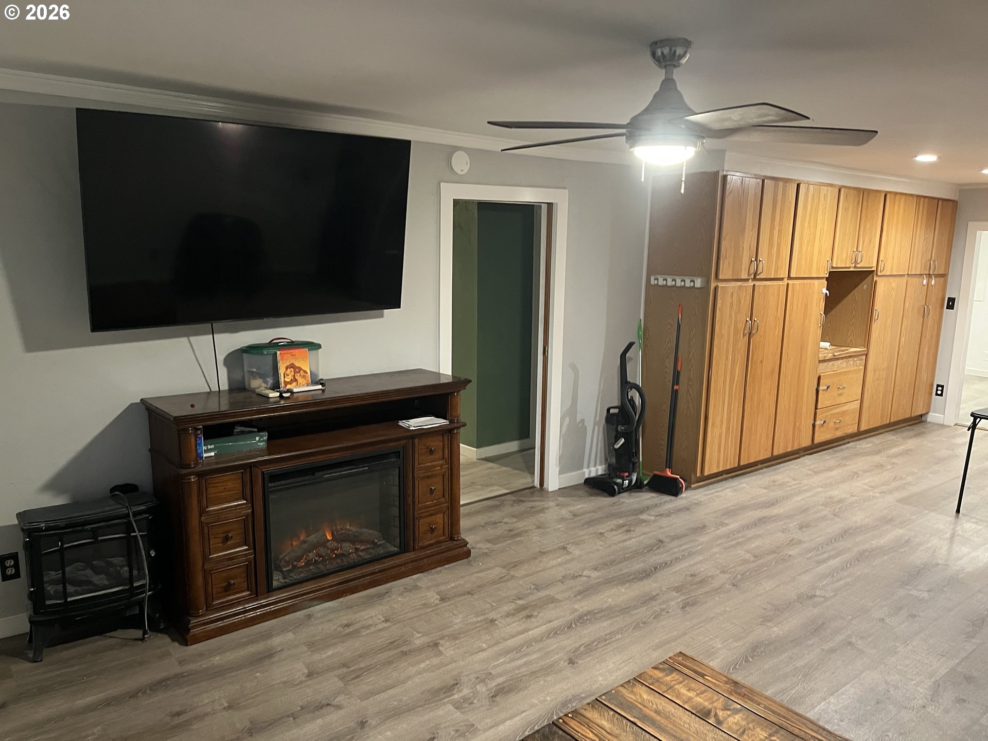 1918 Southeast 6th Avenue Camas, WA 98607 - Photo 7 of 17 a living room with a fireplace and a flat screen tv