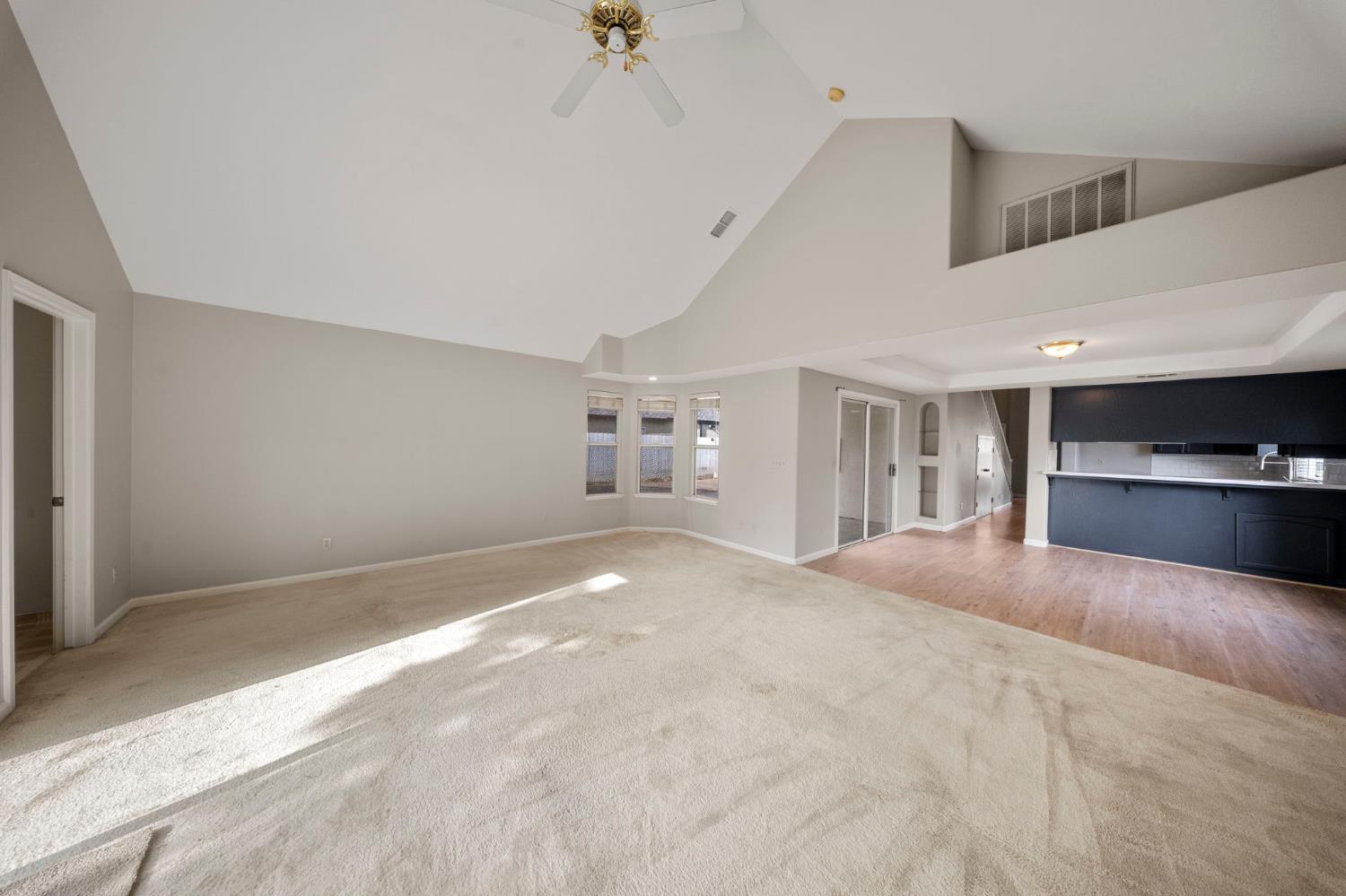 1128 Valencia Court Modesto, CA 95350 - Photo 13 of 30 a view of an empty room with kitchen and window