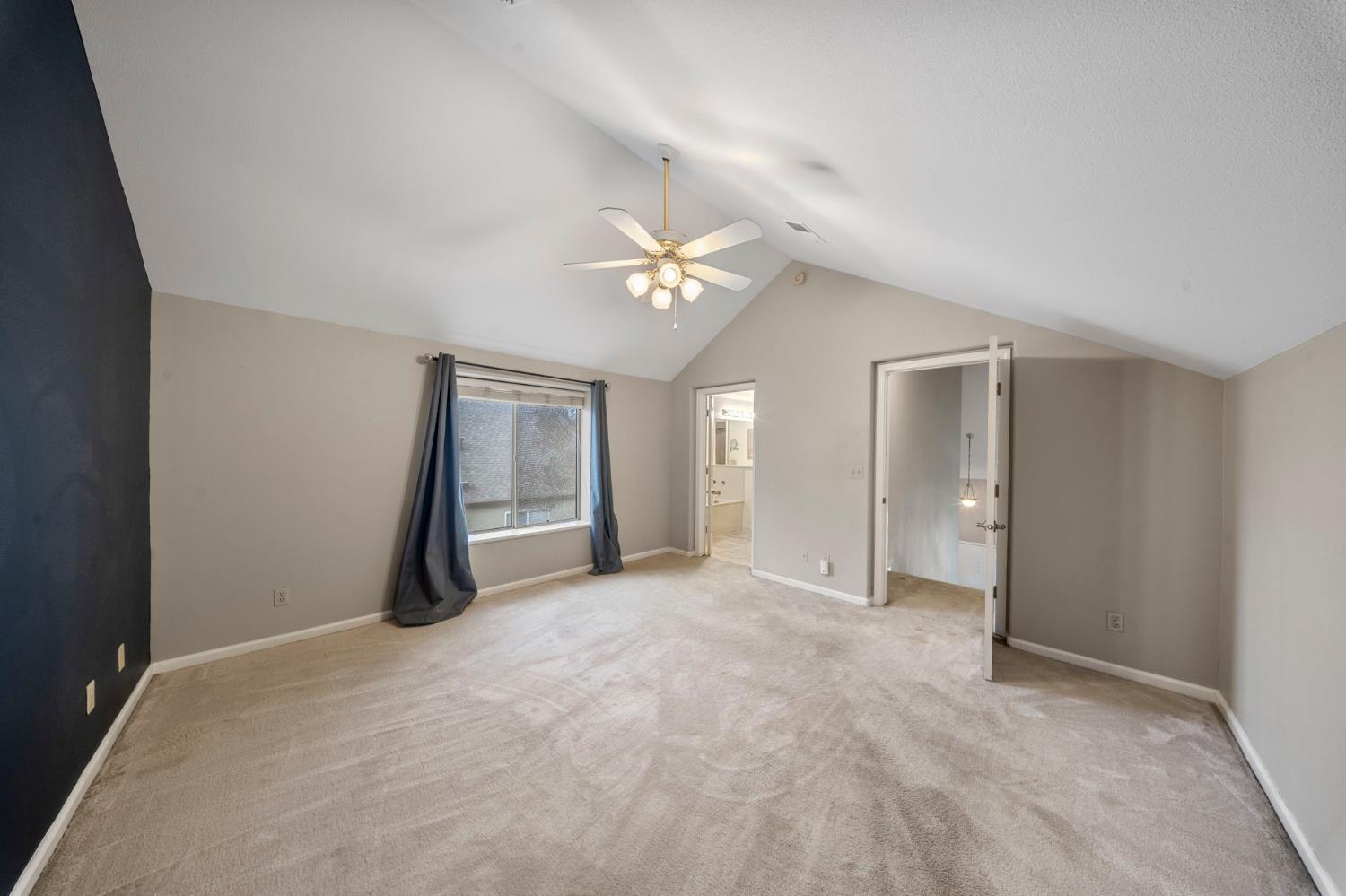1128 Valencia Court Modesto, CA 95350 - Photo 15 of 30 an empty room with closet and a ceiling fan