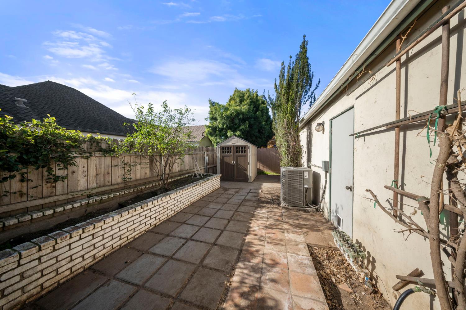 1128 Valencia Court Modesto, CA 95350 - Photo 27 of 30 a view of a backyard with sitting area