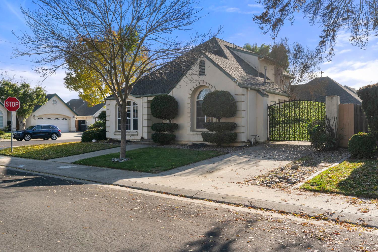 1128 Valencia Court Modesto, CA 95350 - Photo 30 of 30 a front view of a house with a yard and garage