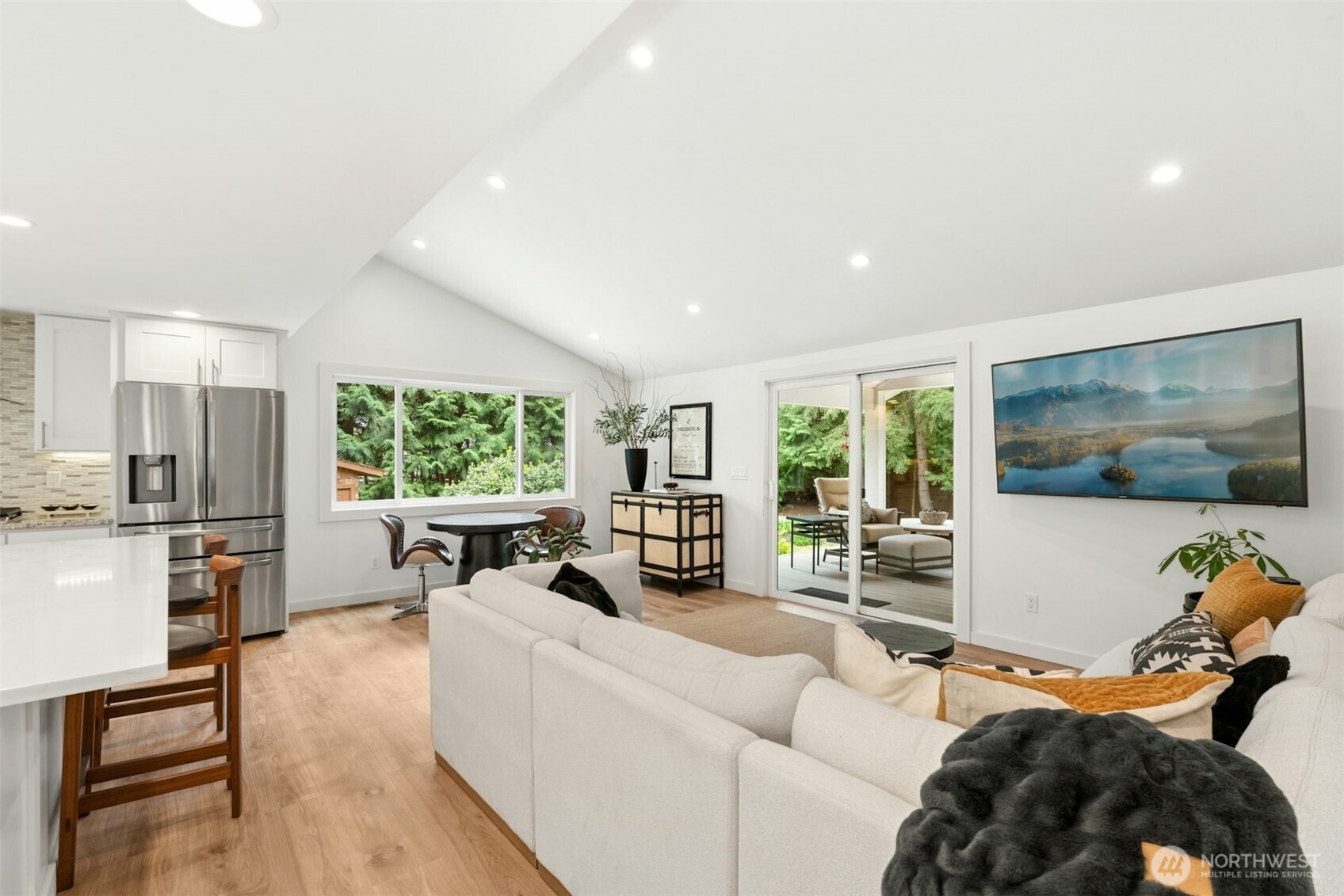 23307 49th Avenue Southeast Bothell, WA 98021 - Photo 6 of 37 a living room with furniture and a flat screen tv