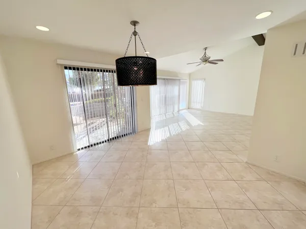 a view of a hallway with a chandelier