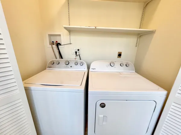 a utility room with dryer and washer