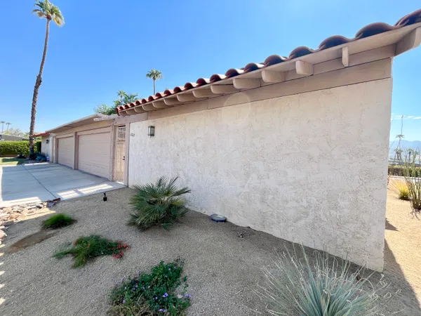 a view of a house with a street