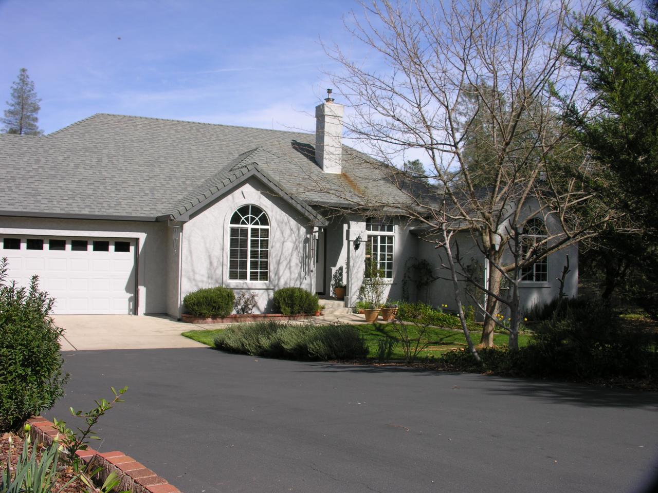 10185 Tilton Mine Road Redding, CA 96001 - Photo 2 of 3 a front view of a house with a yard