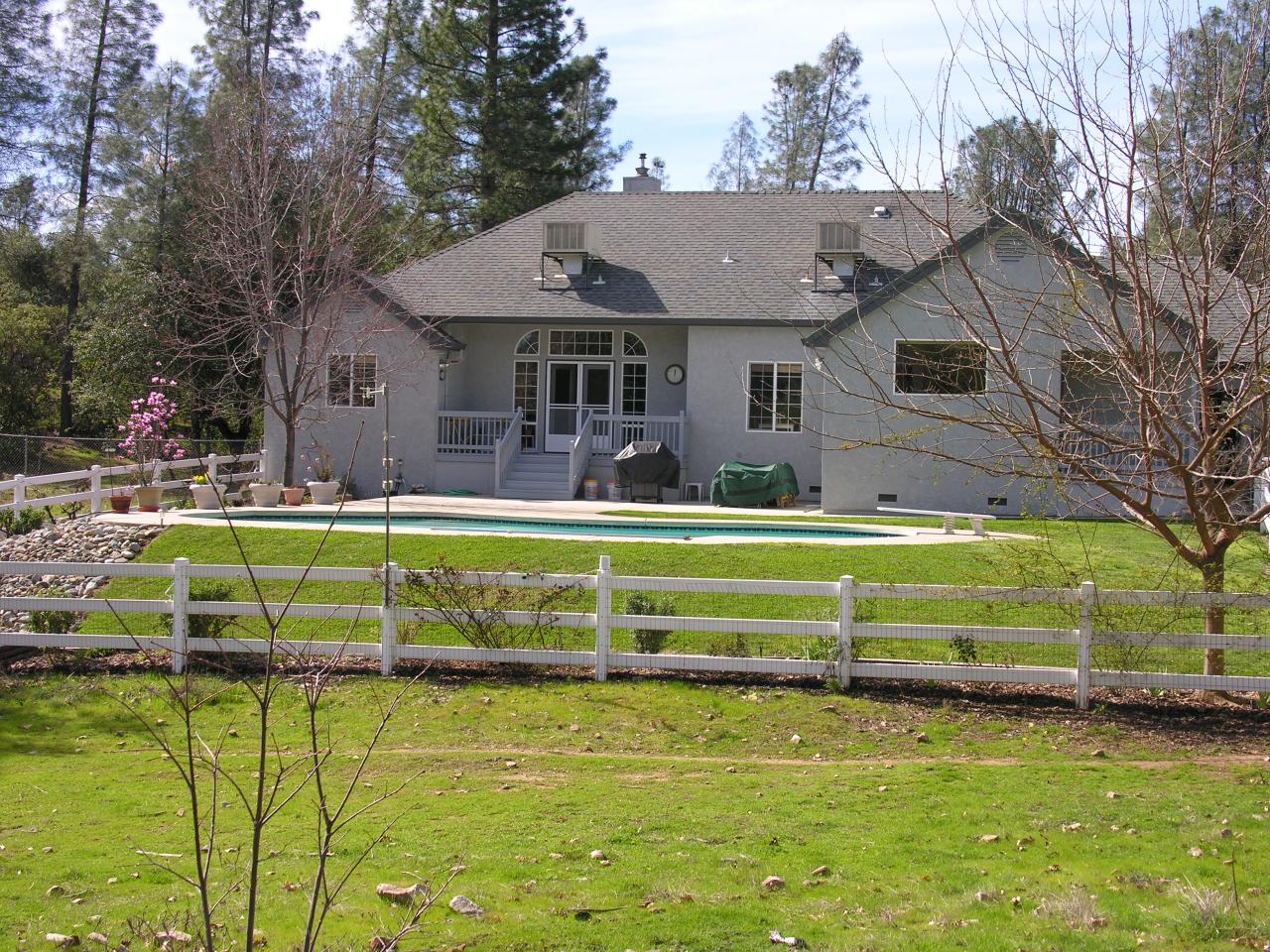 10185 Tilton Mine Road Redding, CA 96001 - Photo 3 of 3 a view of house with a swimming pool