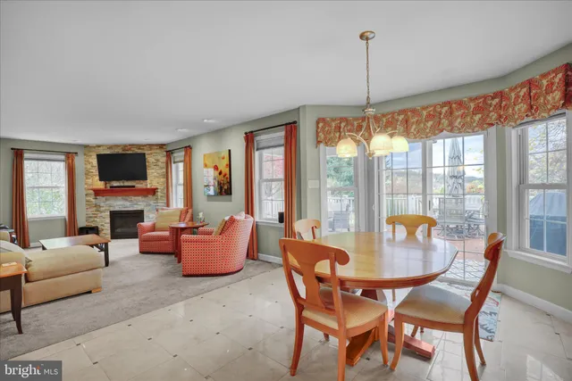 a kitchen with kitchen island a counter top space appliances and cabinets