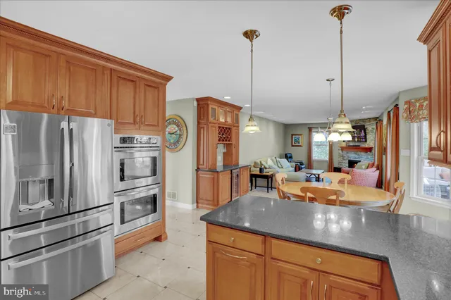 a utility room with cabinets and washer