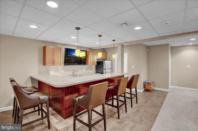 a living room with furniture a rug and a large window