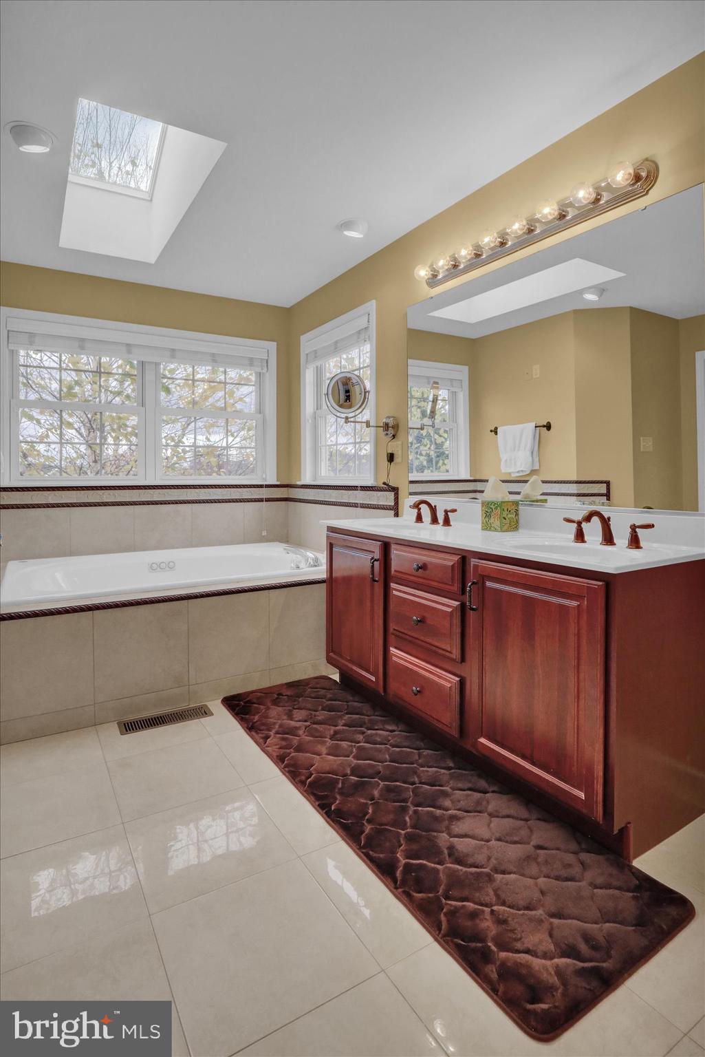35 Pacific Avenue Sinking Spring, PA 19608 - Photo 36 of 63 a spacious bathroom with a sink a mirror and a bathtub
