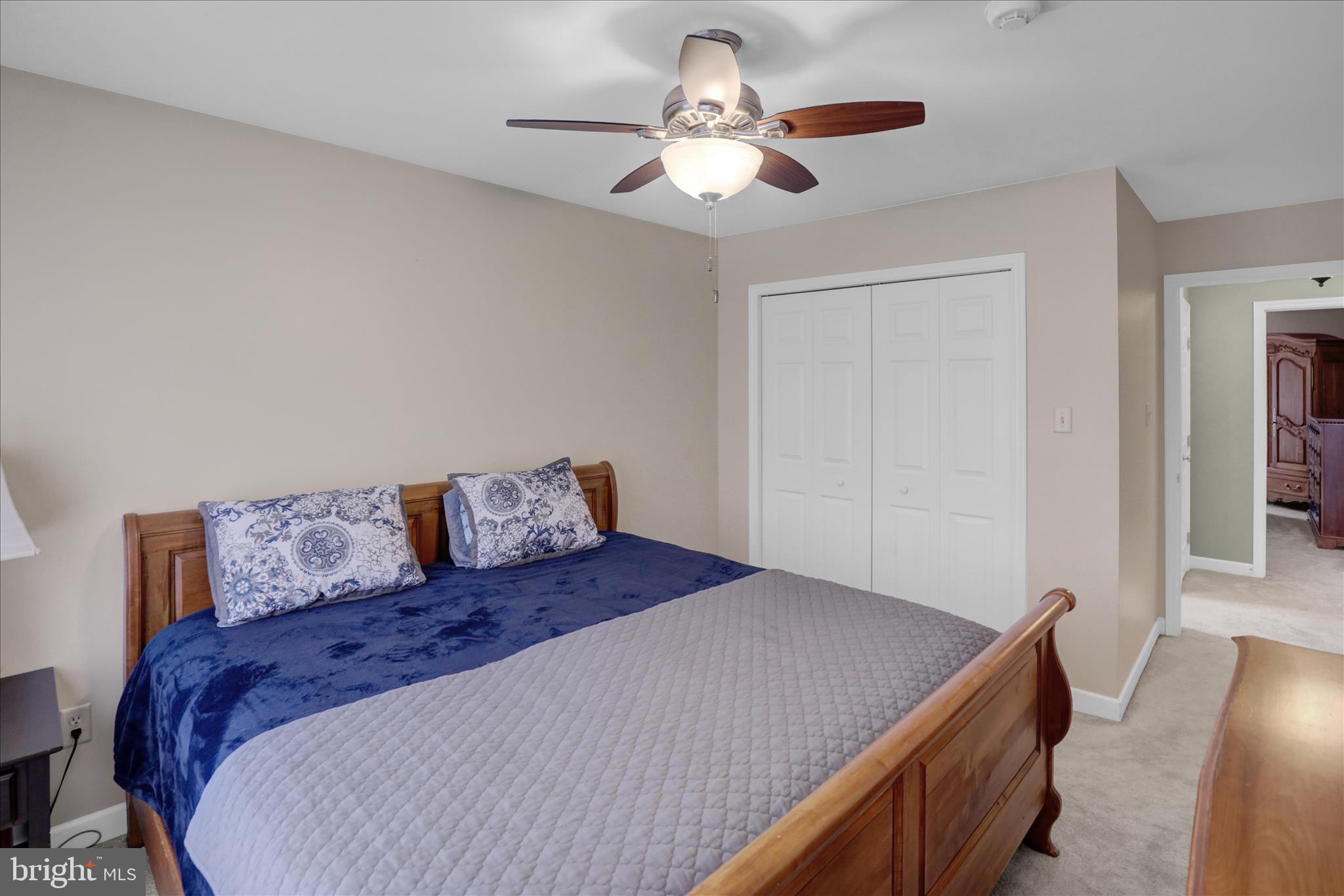 35 Pacific Avenue Sinking Spring, PA 19608 - Photo 40 of 63 a bedroom with a large bed and a chandelier