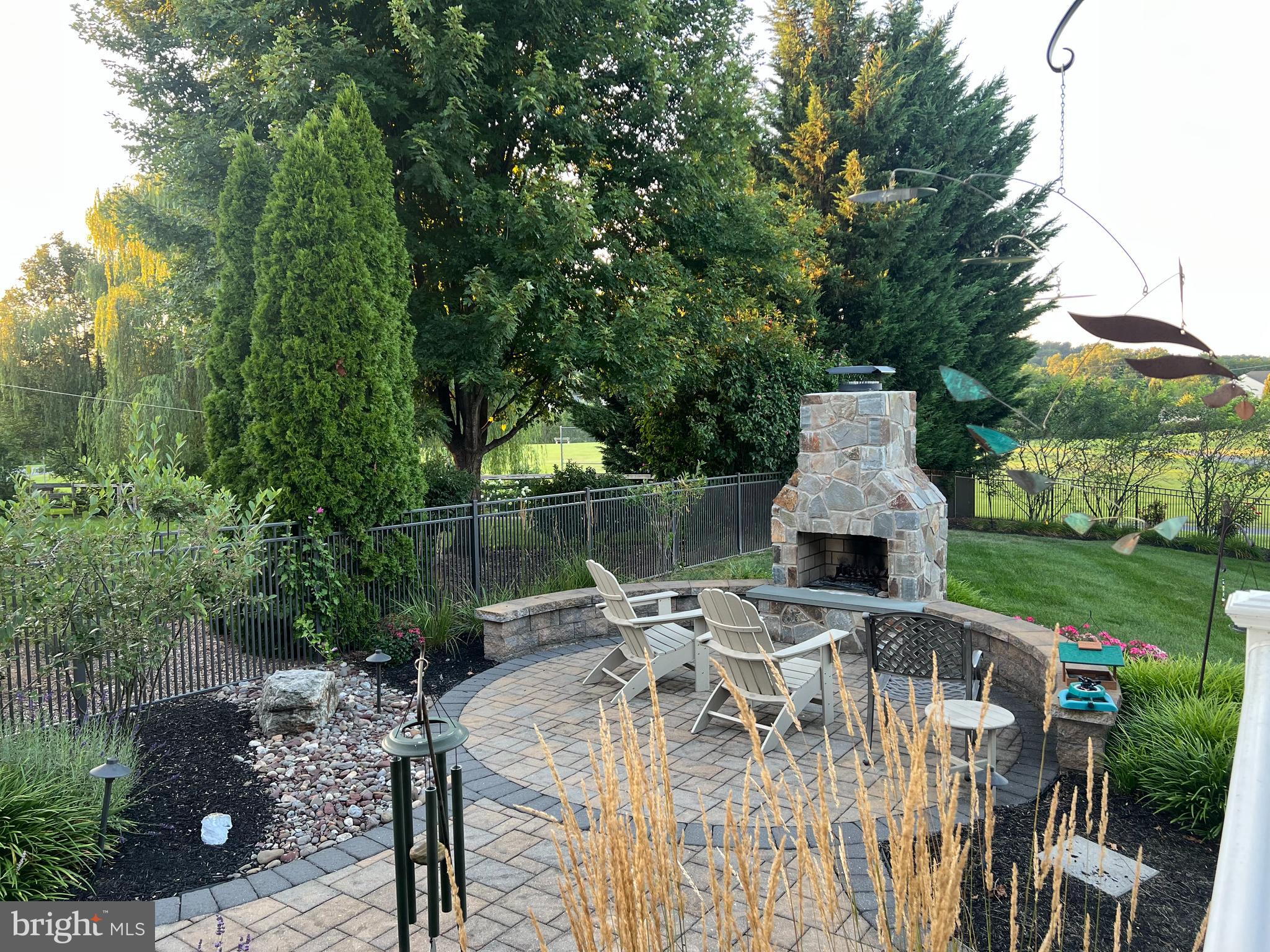 35 Pacific Avenue Sinking Spring, PA 19608 - Photo 6 of 63 a view of a patio with table and chairs a barbeque with wooden fence
