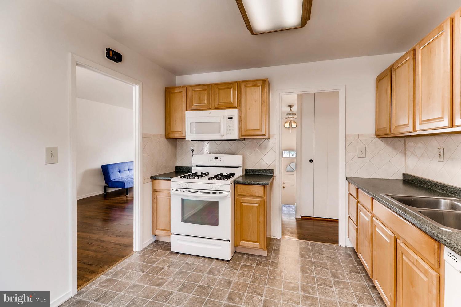 2008 Hanson Road Edgewood, MD 21040 - Photo 14 of 28 a kitchen with a stove a sink and a refrigerator