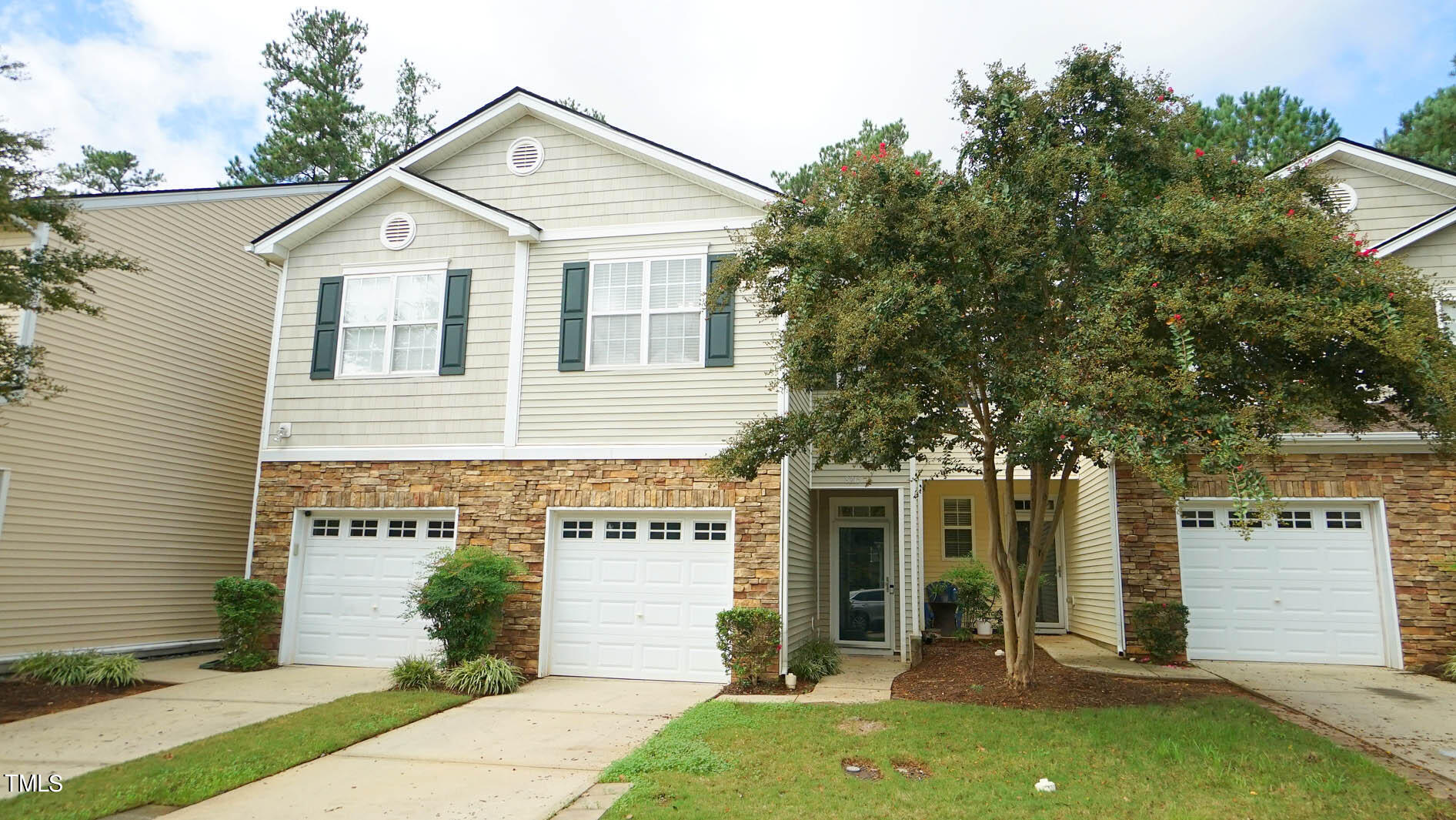 8215 Martello Lane Raleigh, NC 27613 - Photo 1 of 19 front view of a house with a yard