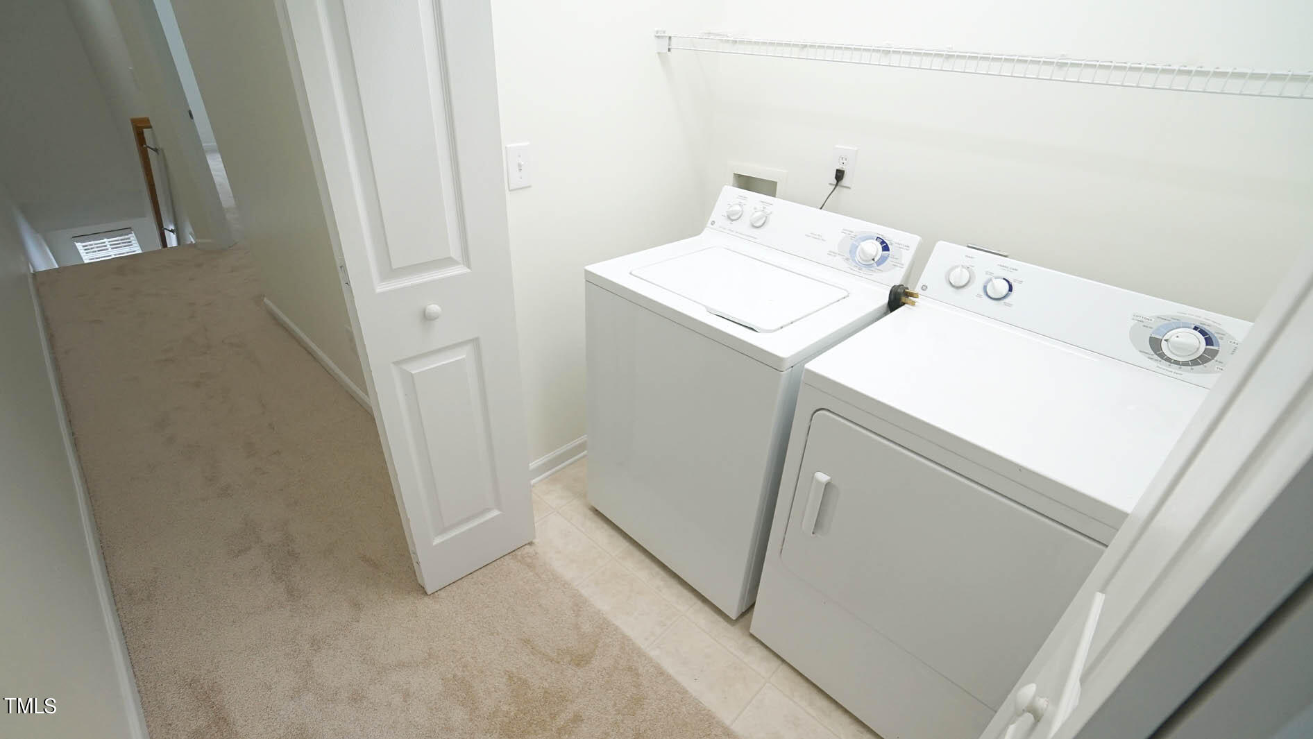 8215 Martello Lane Raleigh, NC 27613 - Photo 15 of 19 a utility room with dryer and washer