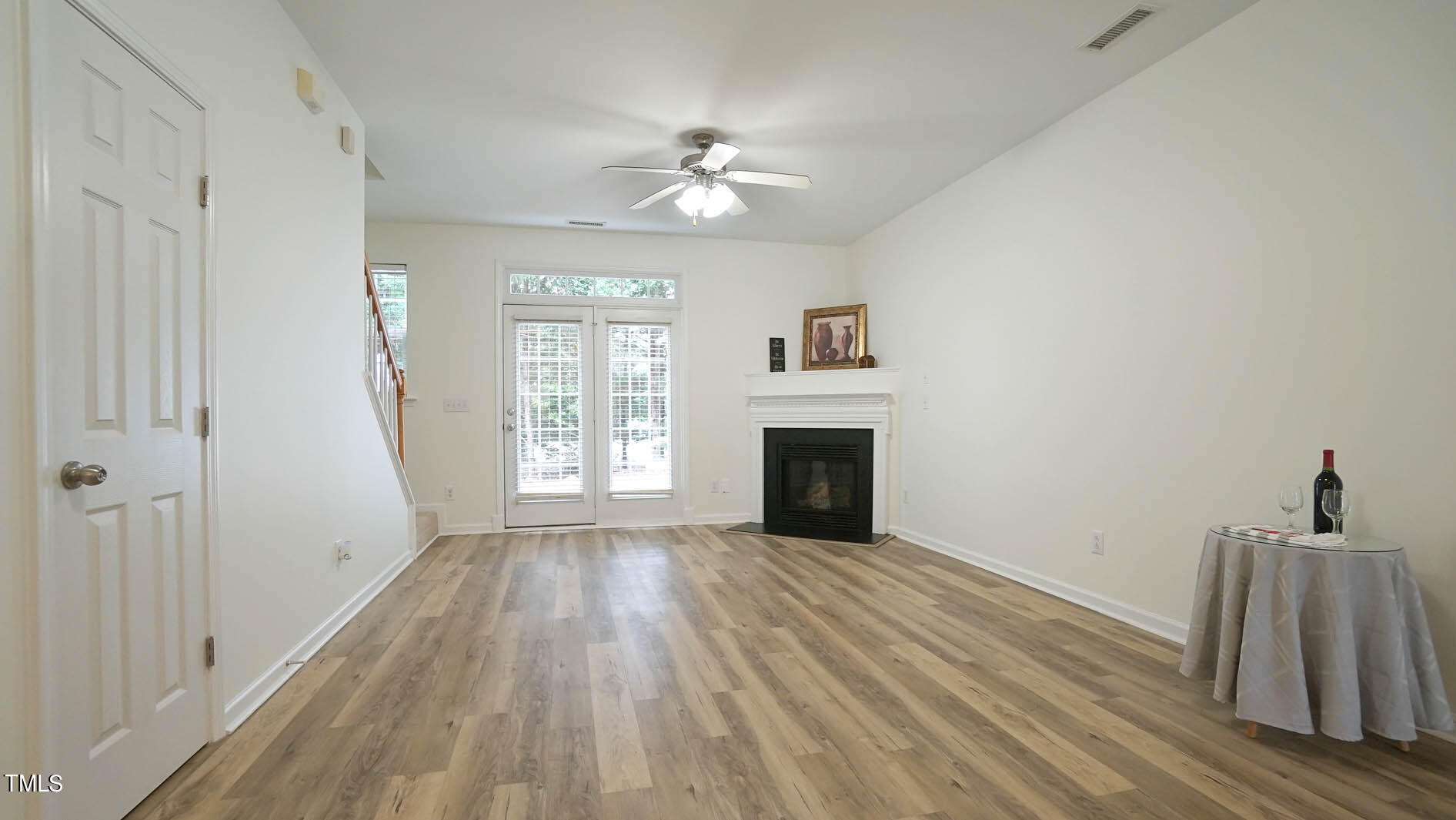 8215 Martello Lane Raleigh, NC 27613 - Photo 2 of 19 a view of livingroom with hardwood floor and a ceiling fan