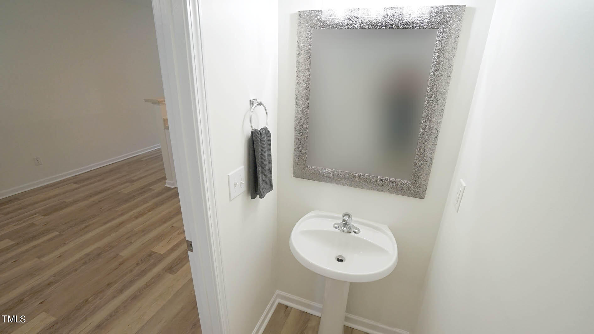 8215 Martello Lane Raleigh, NC 27613 - Photo 9 of 19 a bathroom with a sink and a mirror