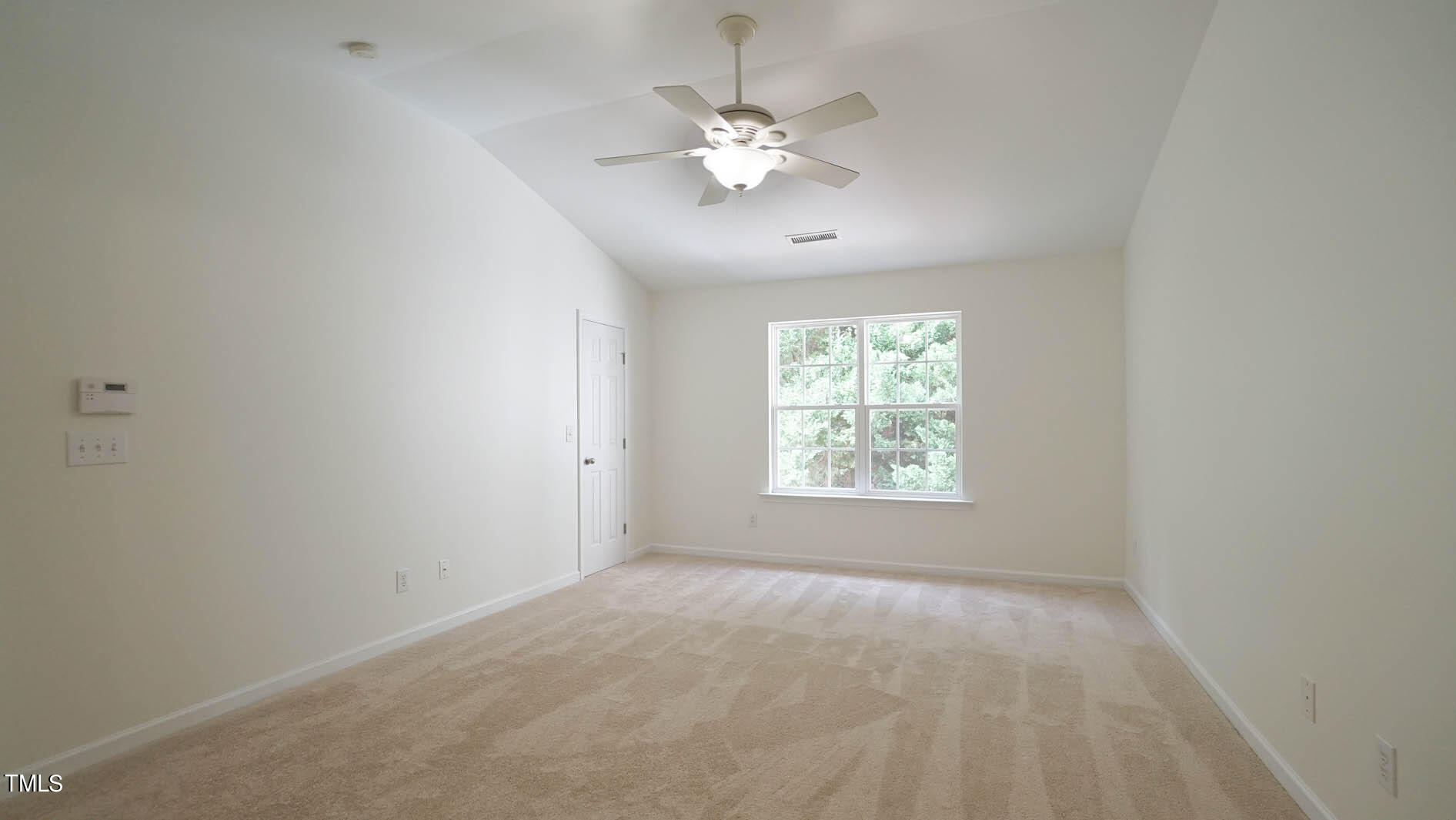 8215 Martello Lane Raleigh, NC 27613 - Photo 10 of 19 a view of an empty room with a window