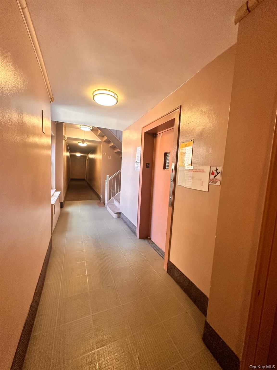 150-11 72nd Road, Unit 6F Queens, NY 11367 - Photo 12 of 31 a view of a hallway with a refrigerator