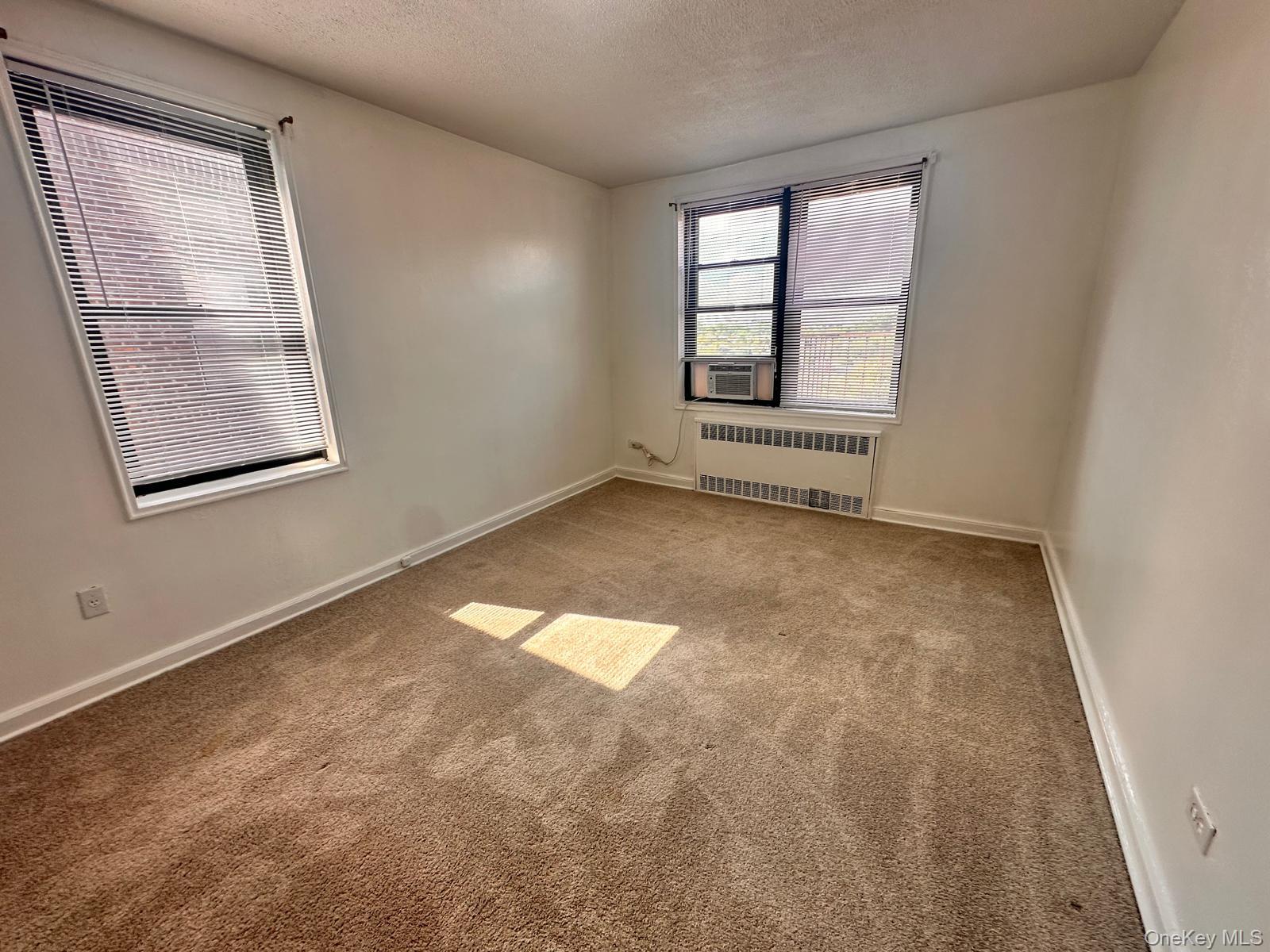 150-11 72nd Road, Unit 6F Queens, NY 11367 - Photo 20 of 31 an empty room with windows