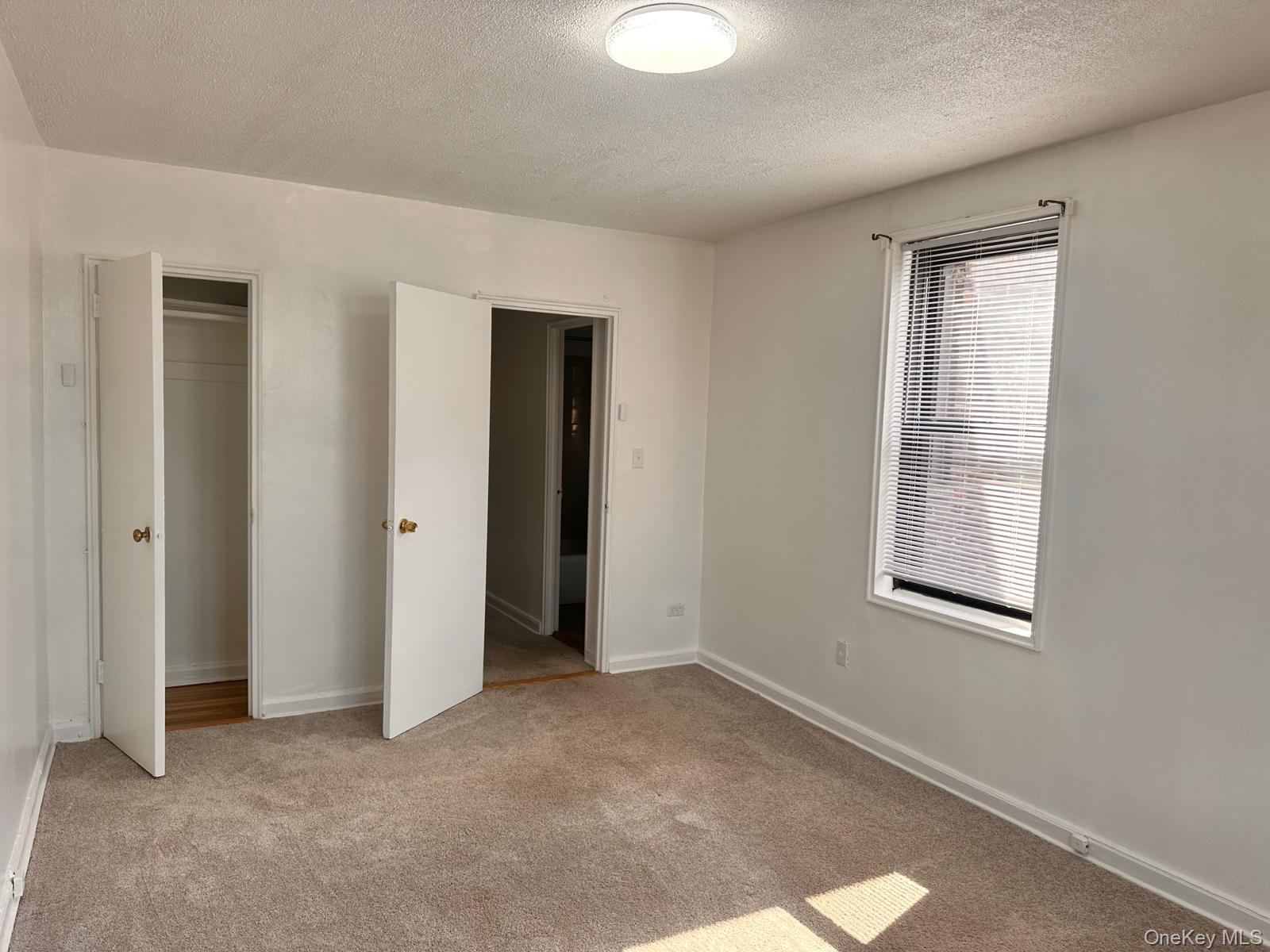 150-11 72nd Road, Unit 6F Queens, NY 11367 - Photo 23 of 31 an empty room with windows