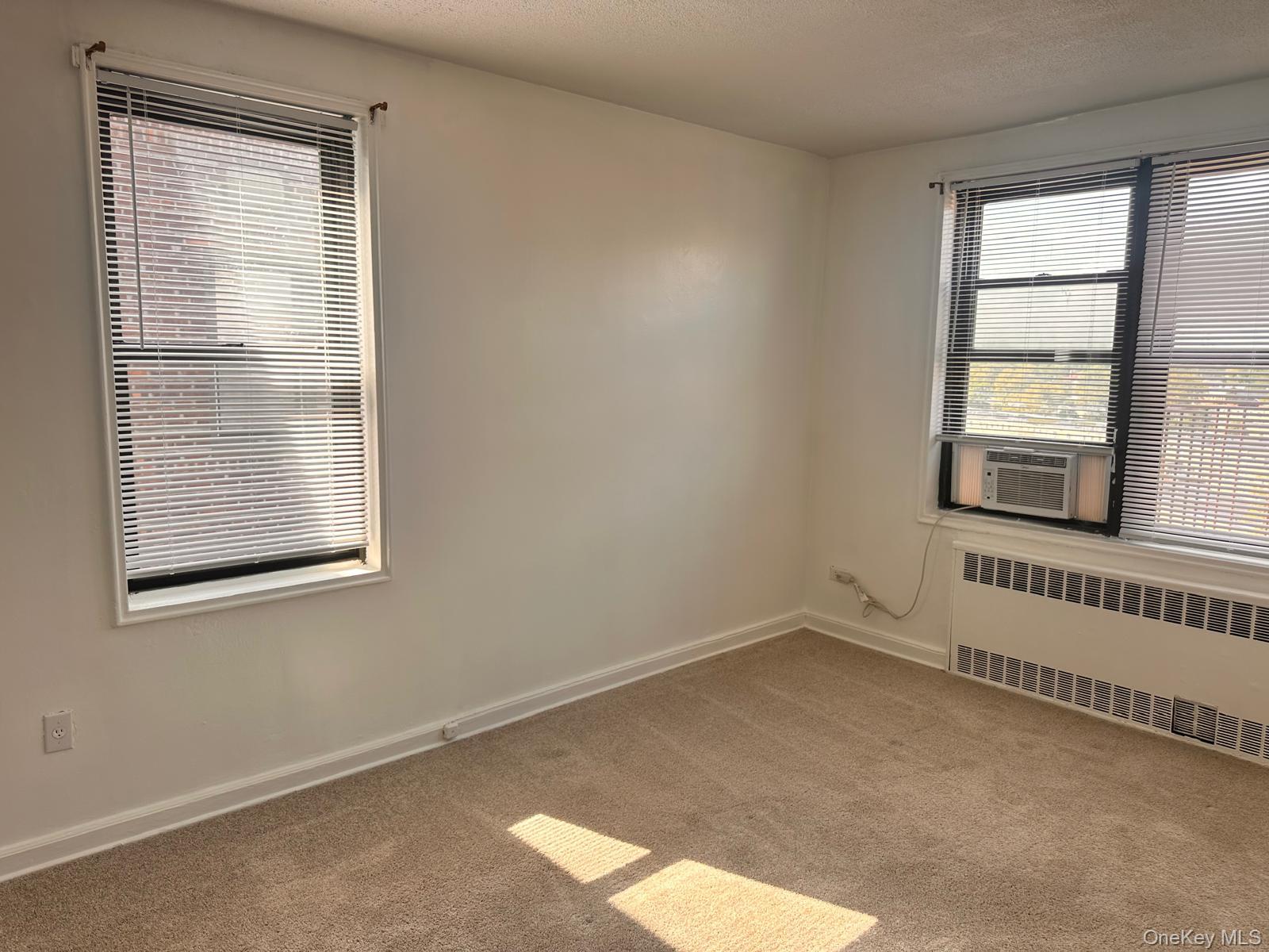 150-11 72nd Road, Unit 6F Queens, NY 11367 - Photo 25 of 31 an empty room with a window