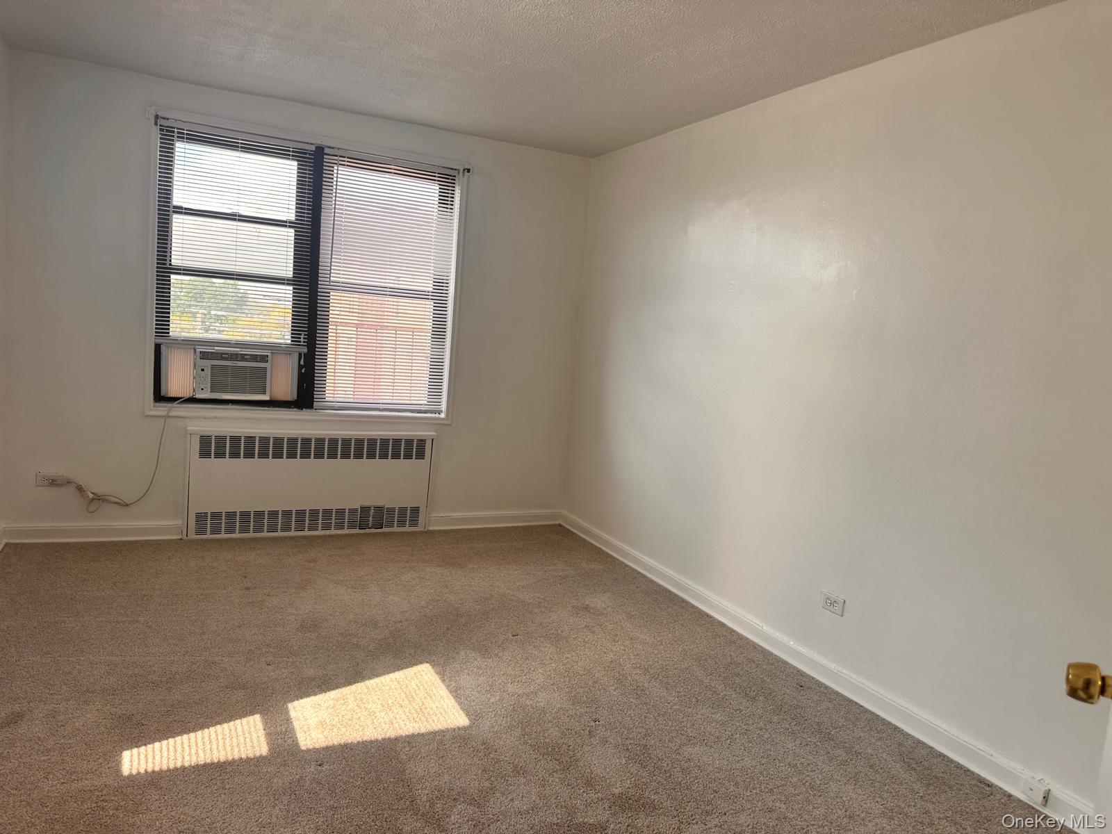 150-11 72nd Road, Unit 6F Queens, NY 11367 - Photo 26 of 31 an empty room with a window