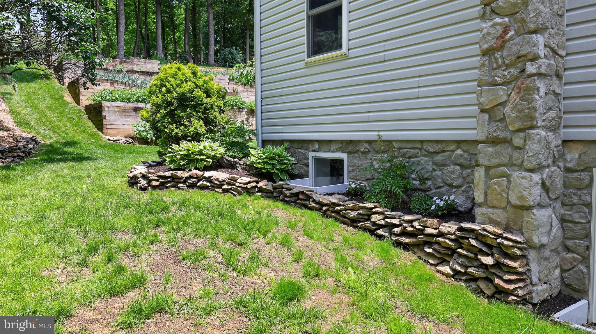 257 Hill Road New Holland, PA 17557 - Photo 38 of 94 Lush greenery and stone accents unite.