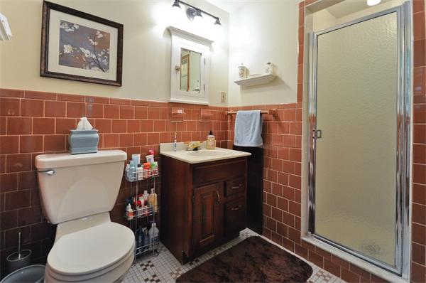 37 Oak Hill Road Wayland, MA 01778 - Photo 16 of 22 a bathroom with a toilet sink and mirror