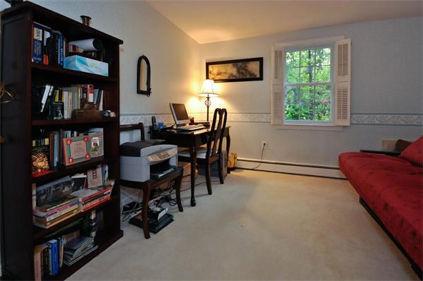 37 Oak Hill Road Wayland, MA 01778 - Photo 19 of 22 a view of a workspace with furniture and a bookshelf