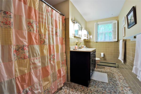 37 Oak Hill Road Wayland, MA 01778 - Photo 20 of 22 a bathroom with a sink a mirror and a shower curtain