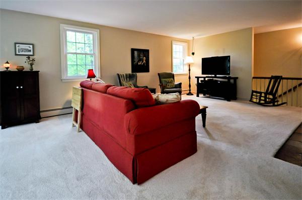37 Oak Hill Road Wayland, MA 01778 - Photo 5 of 22 a living room with furniture and a flat screen tv