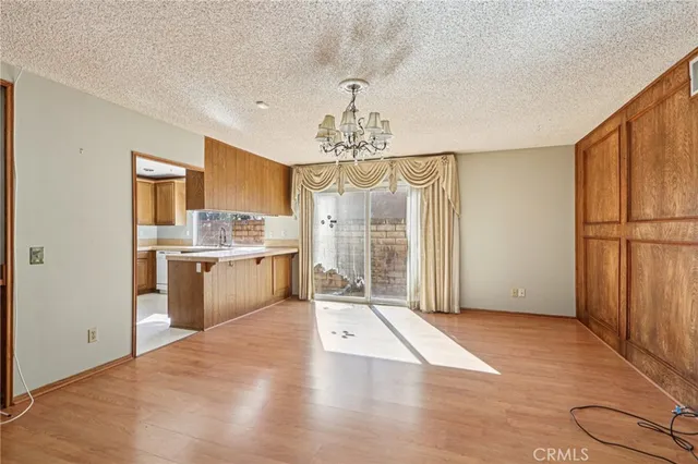 a large kitchen with cabinets and stainless steel appliances