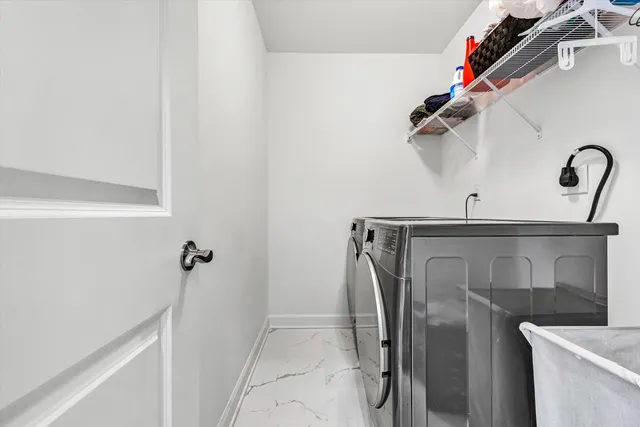 a spacious bedroom with a bed and a ceiling fan