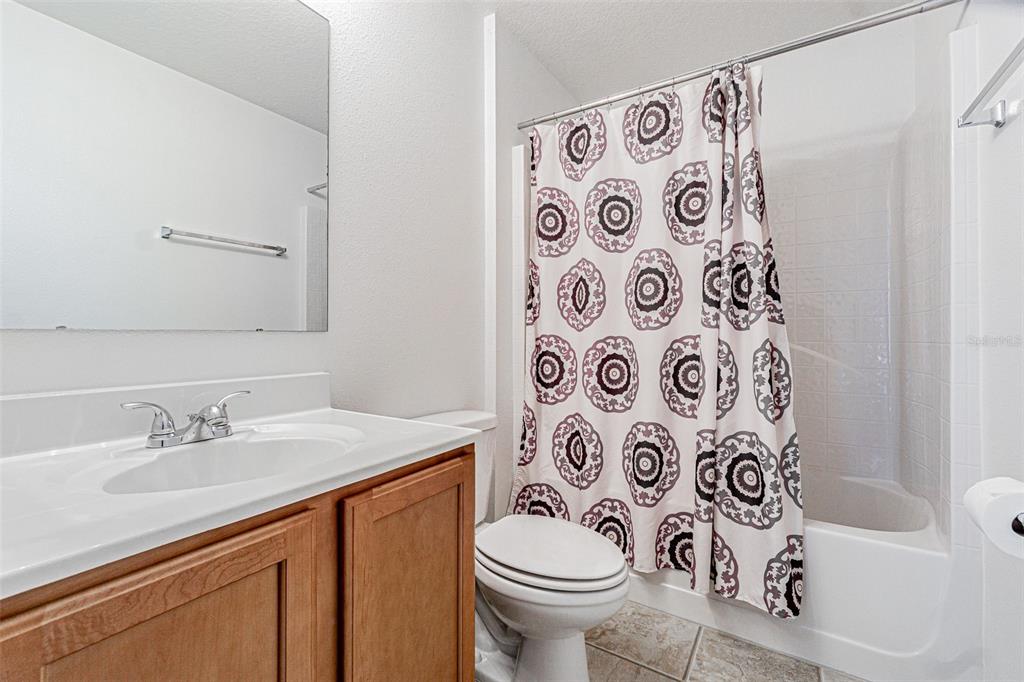 6283 Lorraine Lane Spring Hill, FL 34608 - Photo 20 of 27 a bathroom with a sink and a toilet